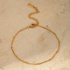 Tobillera con cuentas y cadena elegante