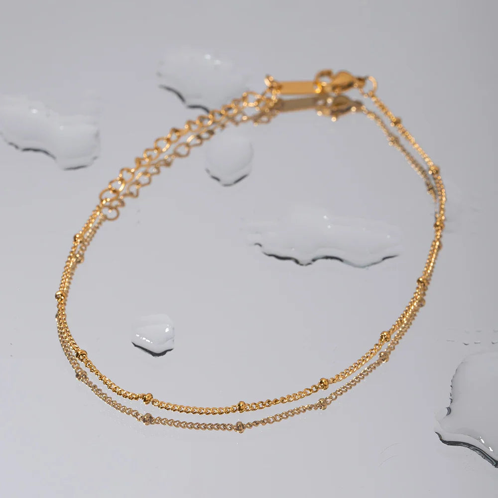 Tobillera con cuentas y cadena elegante
